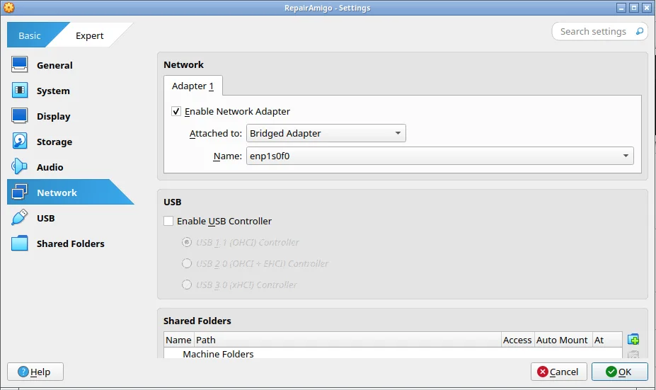 Settings de RepairAmigo, página Network: Adapter 1 activado, Attached to en Bridged Adapter y la tarjeta de red de la computadora escogida en Name